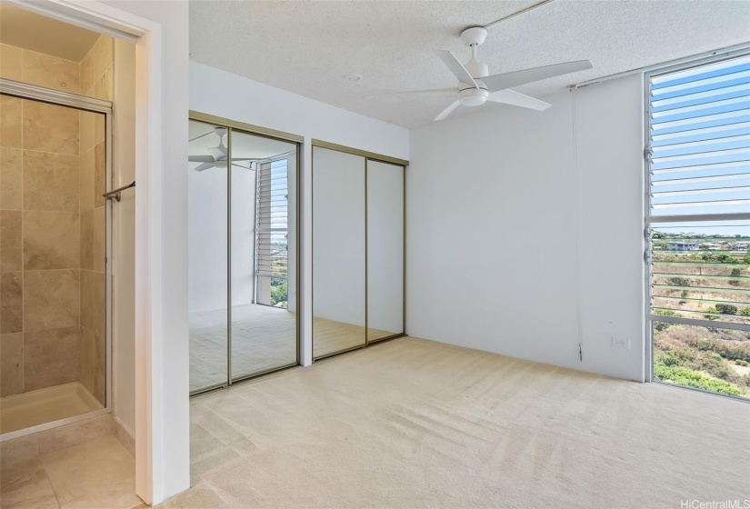 Master bedroom with jalousie windows for natural cooling