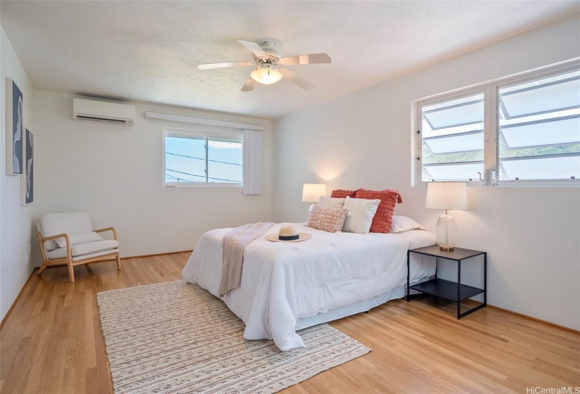 Another view angle of your primary bedroom showcases the spaciousness.