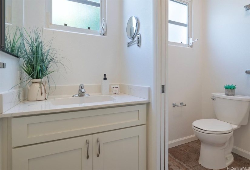 3rd full bath downstairs with step in shower to the right (not pictured).