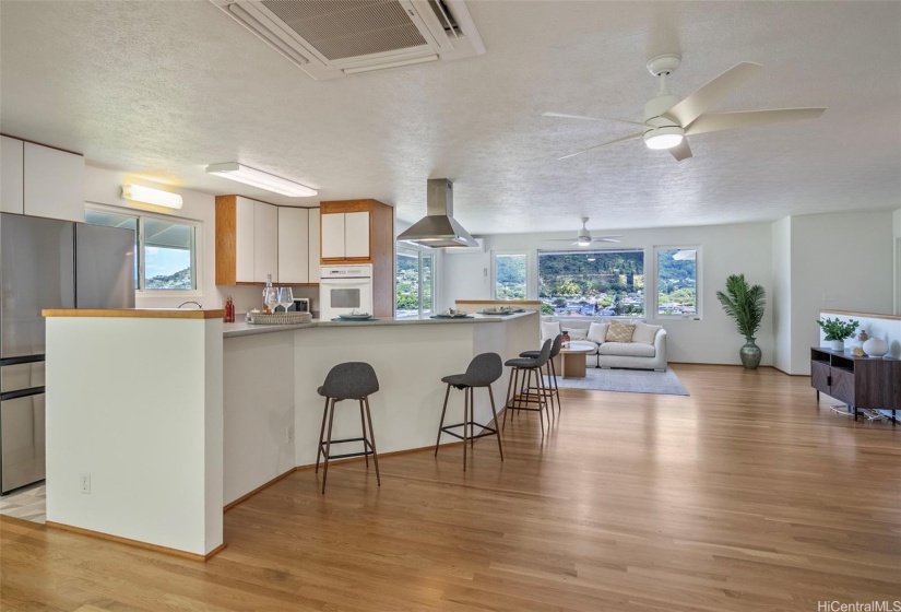 Gorgeous refinished oak wood floors lend to the home's quintessential Manoa charm.