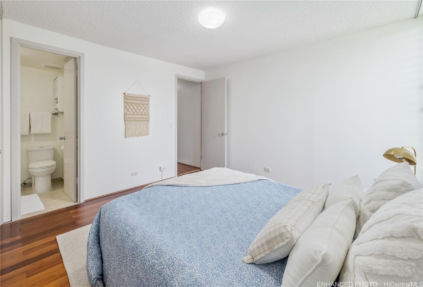 Primary Bedroom with door to Half Bath Enhanced