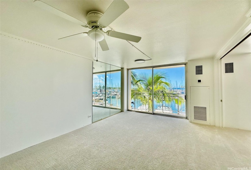 Beautiful lanai glass doors open to a cozy deck area.