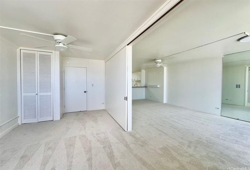 Spacious 1 bedroom with new ceiling fan and divider doors that open to create one large living area.