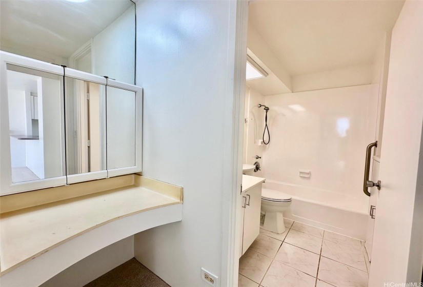 Vanity area and full bath with refurbished tub and new toilet.