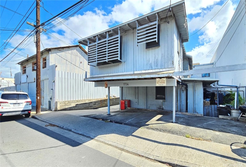 Front residential 2-story building. Outdoor storage area on the right side of building.