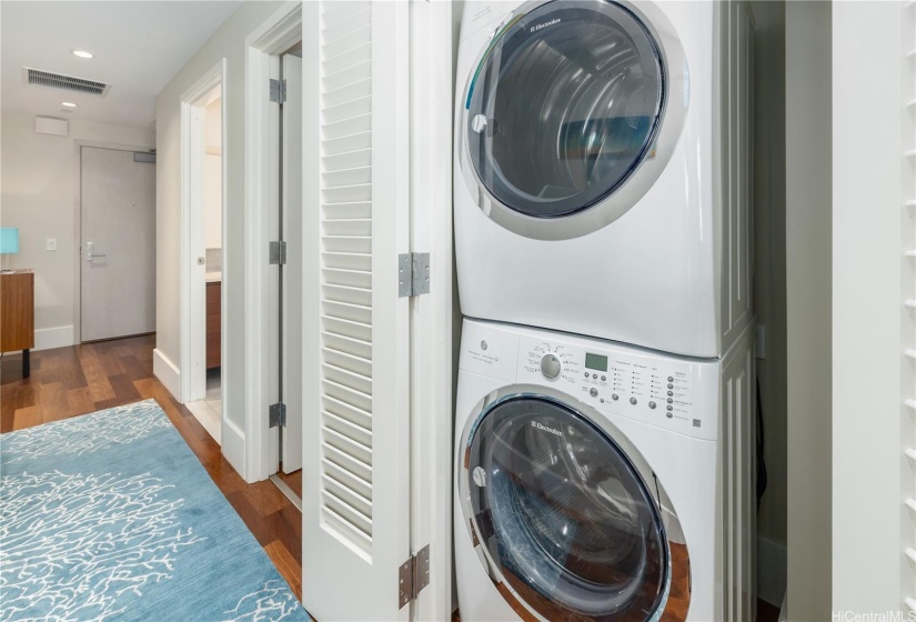 Convenient washer and dryer are off the  hall between the kitchen and bedroom/bathroom