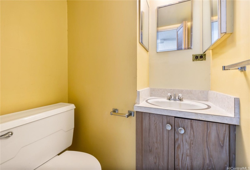 HALF BATHROOM IN THE PRIMARY BEDROOM