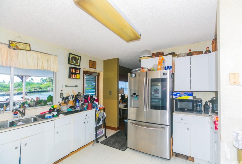 Kitchen looking out to patio and ocean