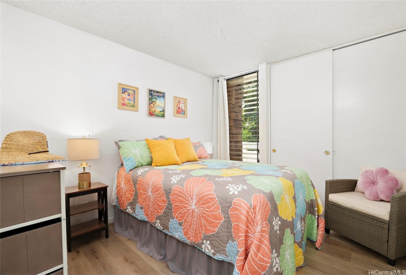 Bedroom with a window to the lanai