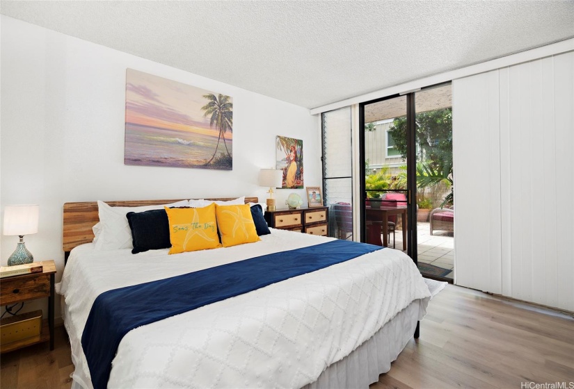 Private patio sliding door to your lanai as seen here from your main bedroom.  The vertical blinds can be opened up wider for the full sun exposure.