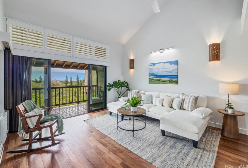 Beautiful open living room has new brush box hardwood floors