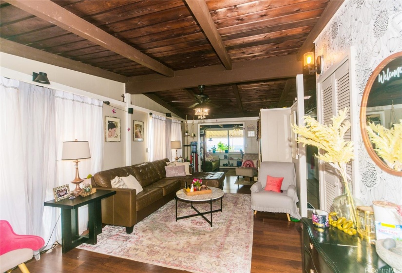 walking in the front door, the living room, dining room, enclosed lanai and open lanai