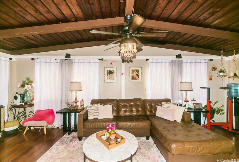 A view of the vaulted ceilings and wood floors in the living room