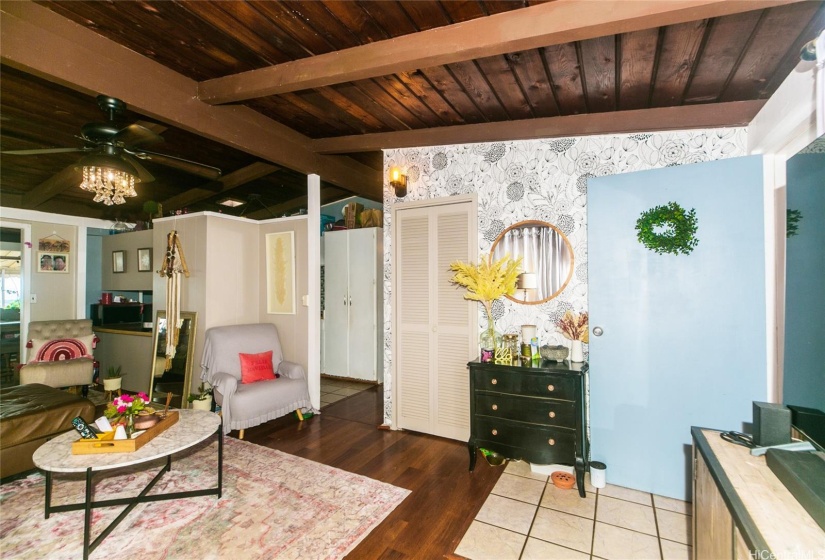 Looking at the entrance to the hall, and the kitchen beyond the living room