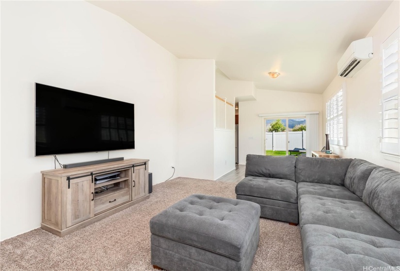 Living room leading to your dining area and kitchen. (Vinyl plank flooring below large area carpet)