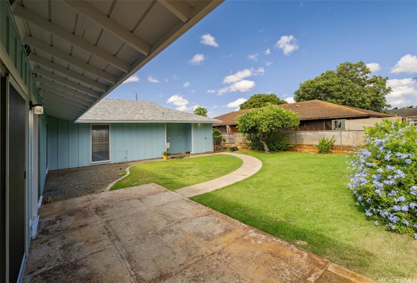 Spacious backyard separates the front and back of the house.