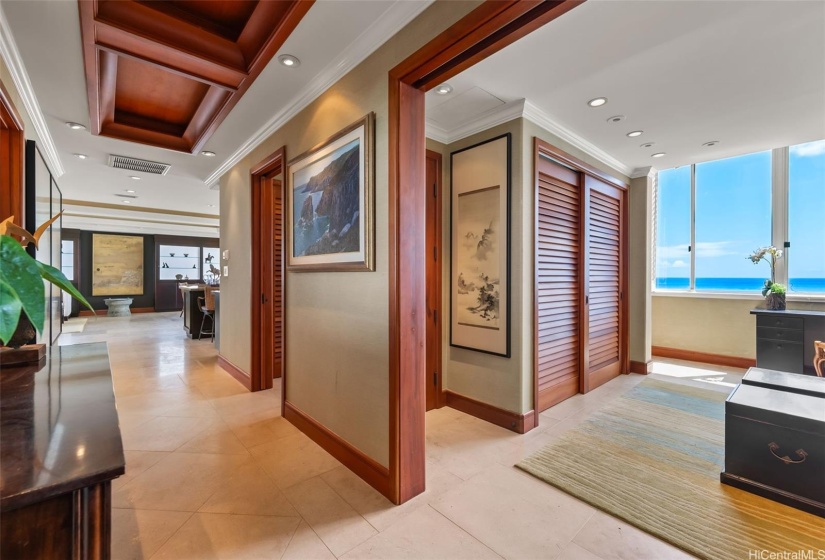 View of the entrance to the guest bedroom on your left and living area in the background