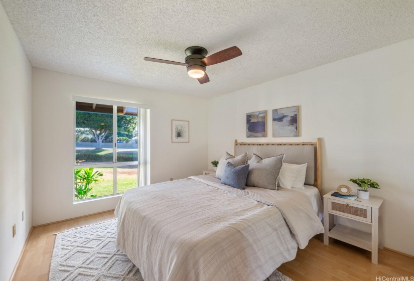 Primary bedroom with large windows and large closet.