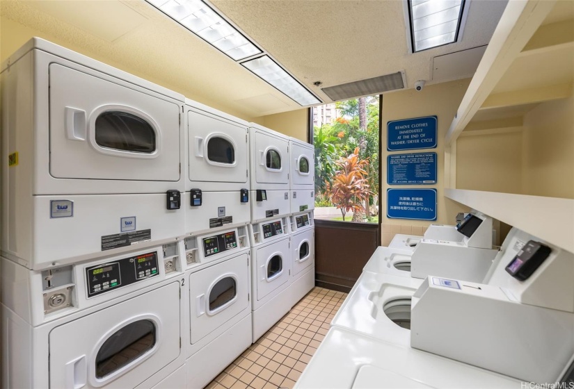 Several machines in the community laundry located on the ground fllor