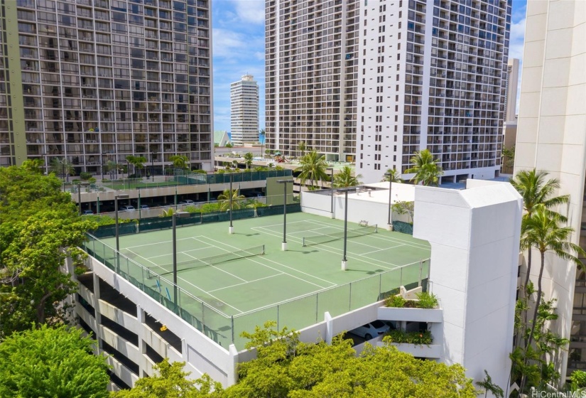 Tennis courts are located on the rooftop of the parking structure