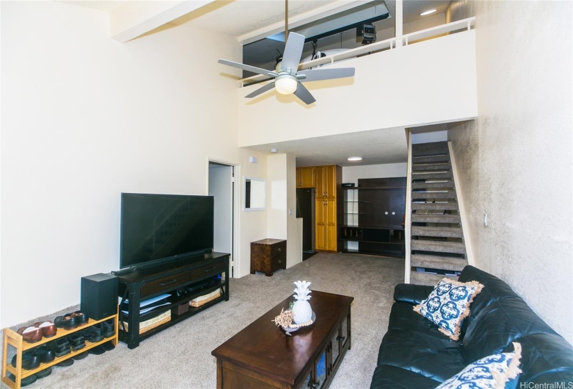 Living area view to upstairs loft