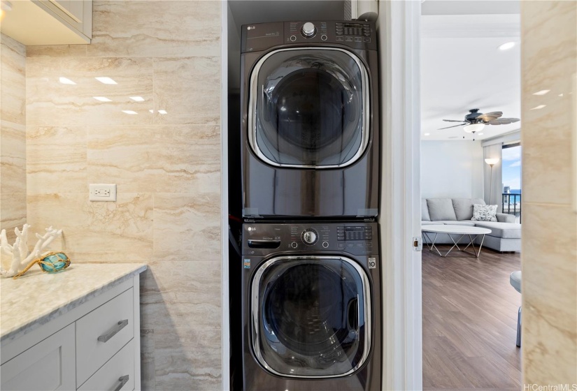 Full sized stacked washer and dryer.