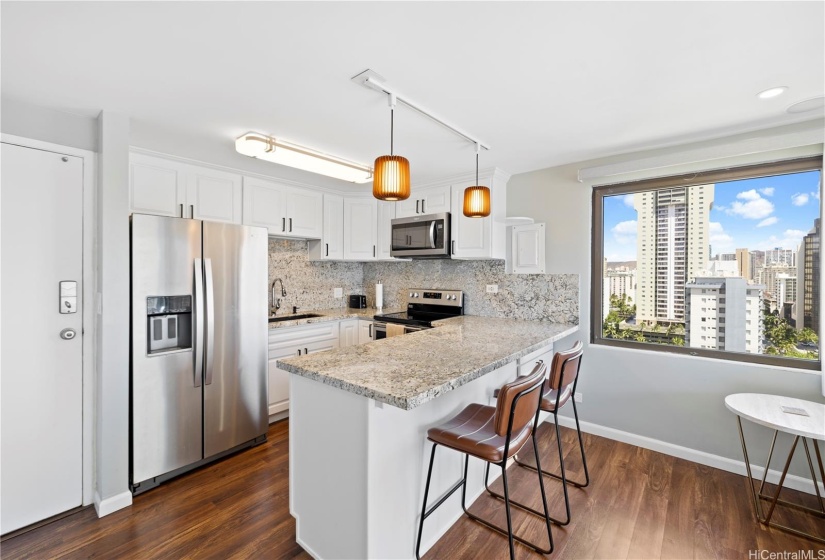 The open kitchen allows counter top seating.