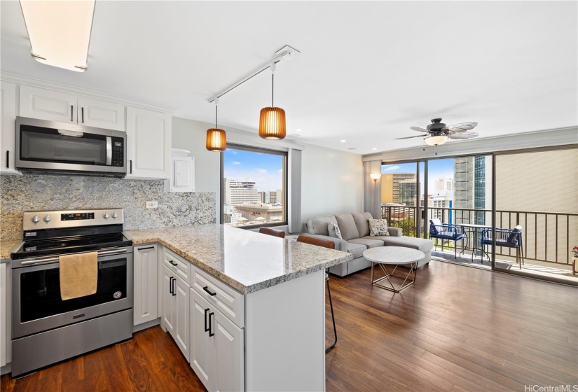 The kitchen opens up to the living area providing able natural light.