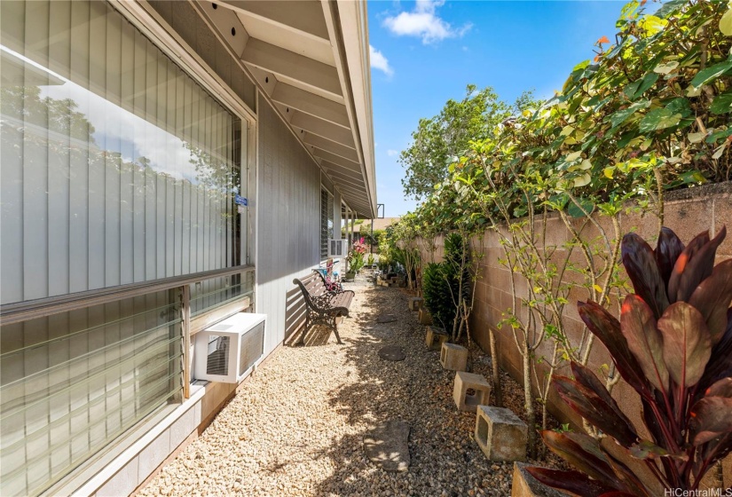 Left side of the house when facing the street, concrete fence