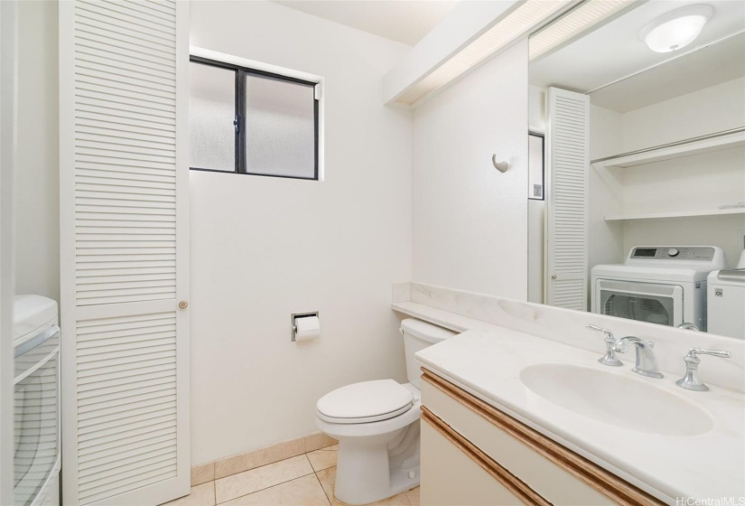 Downstairs 1/2 bathroom with washer and dryer.
