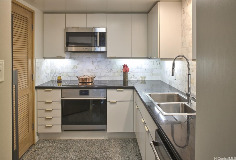 Kitchen with high-end appliances, custom backsplash