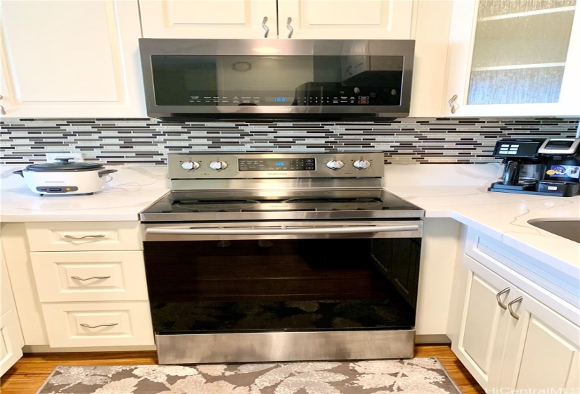 kitchen with stone countertops and tiled backsplash