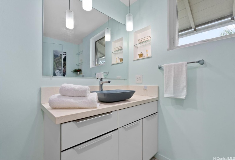 Main home bathroom vanity with vessel sink.