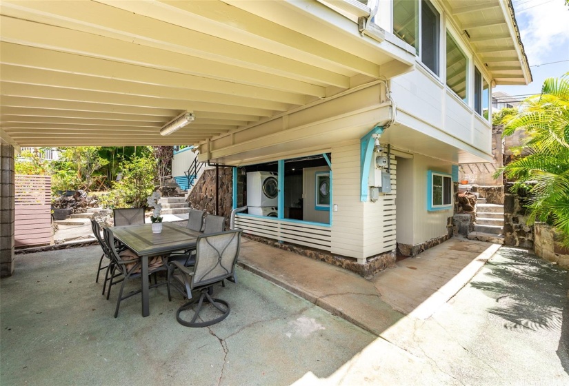 Just outside the main home is a huge covered lanai that has hosted many grand parties.  The laundry area and exterior of the finished basement with Japanese style furo bathroom can be seen here.