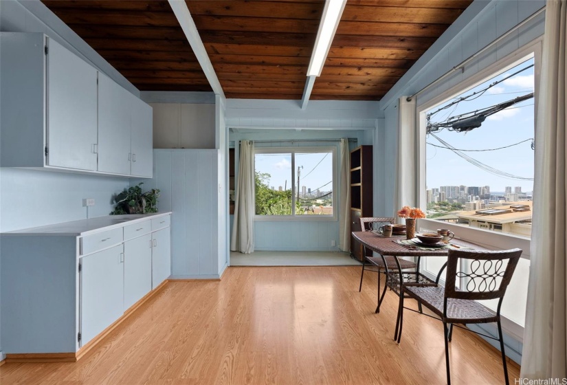 1/1 cottage off of St. Louis Dr. looking from the dining area towards the kitchenette. Awesome city views from newer double pane picture windows.