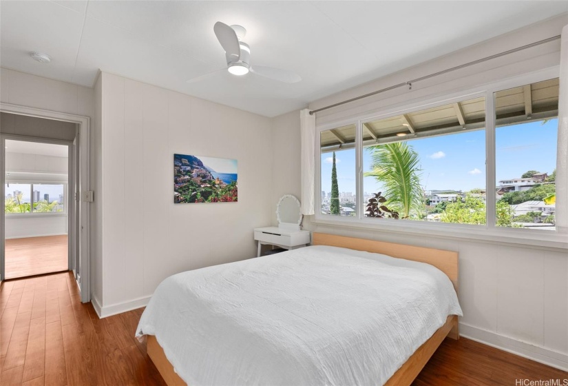 The primary bedroom features split AC and newer double pane windows.