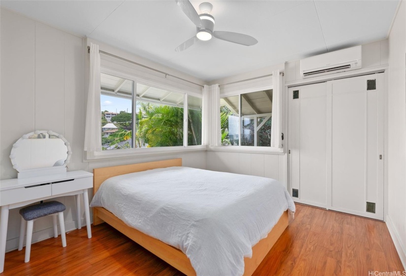 Primary bedroom with split AC and closet