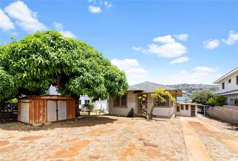 This home features an open concept front yard with ample space and sunlight, ideal for creating your dream garden.