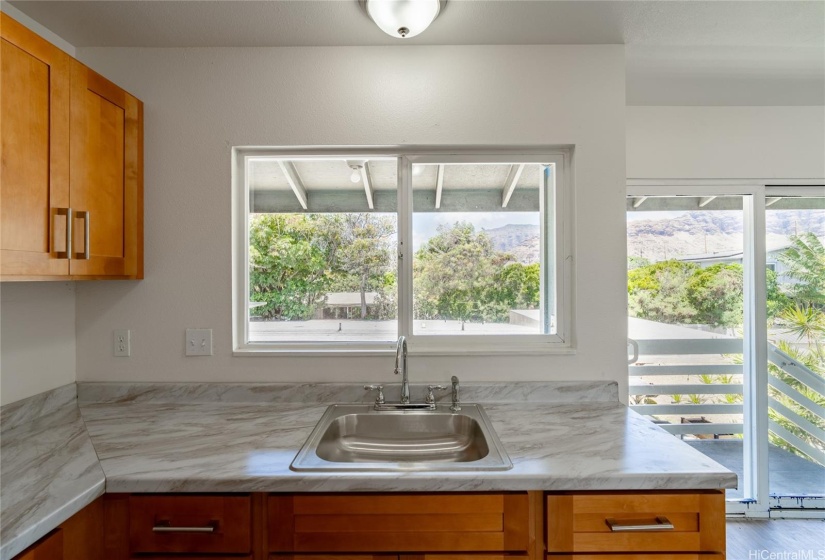 Kitchen sink in mauka unit.  Lanai behind the sink has washer and dryer hook ups.