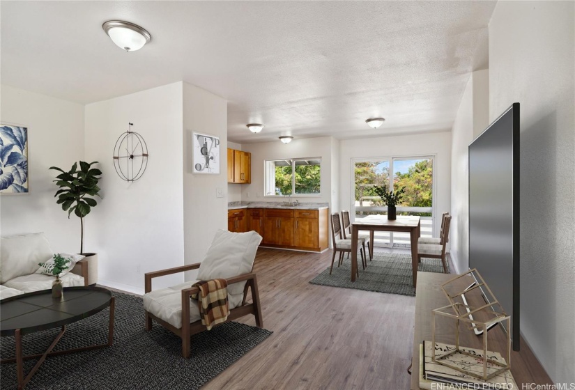 Living area looking at the kitchen in the mauka unit.  This photo is digitally staged and enhanced.