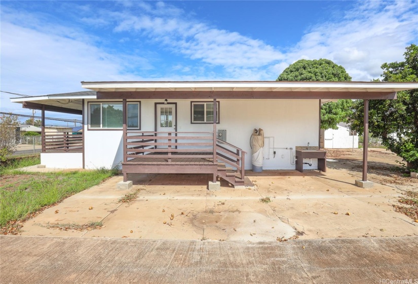 side of house, covered lanai and utility area