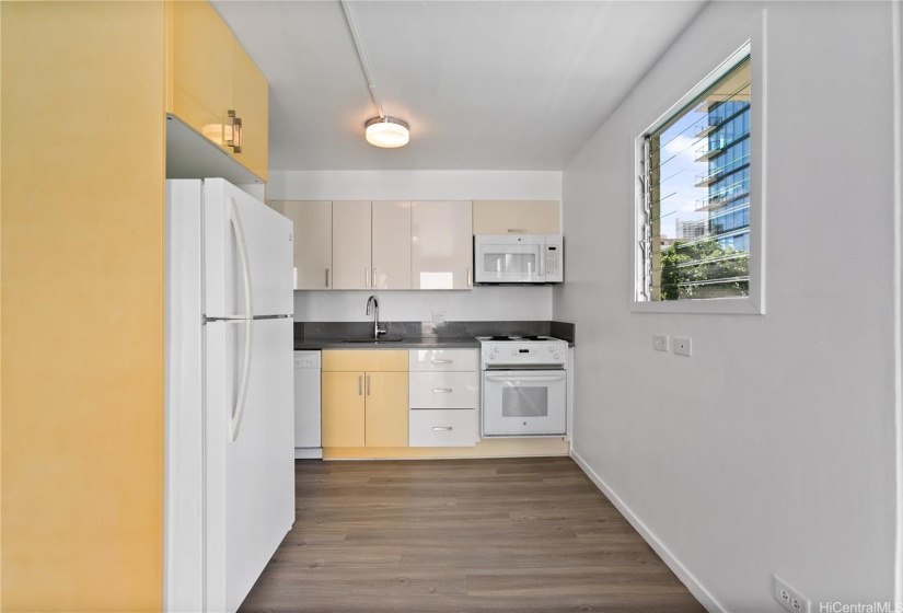 Kitchen with room for small dining table.