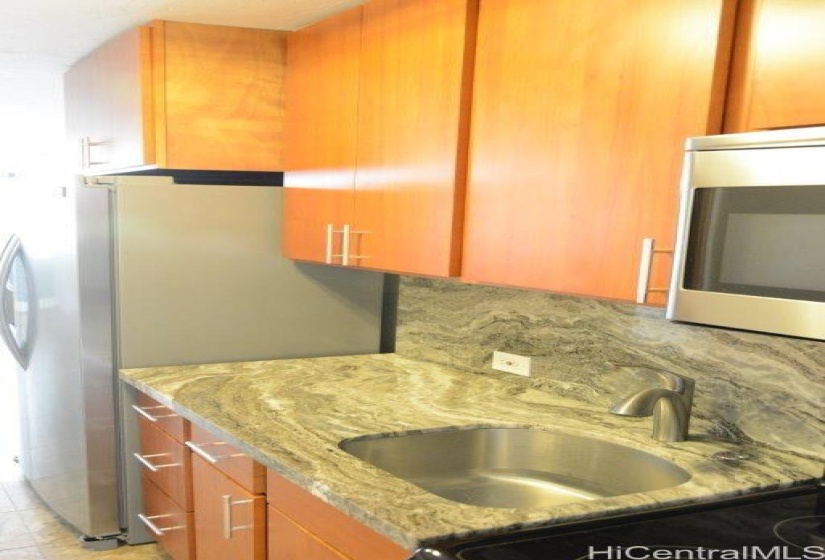 Kitchen cabinets, granite counter top and stainless sink