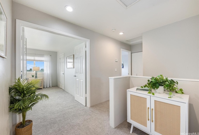 Double doors leading to the primary bedroom suite