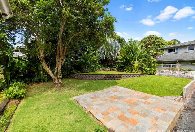 Enhanced.slate tiled patio area and the Lychee tree