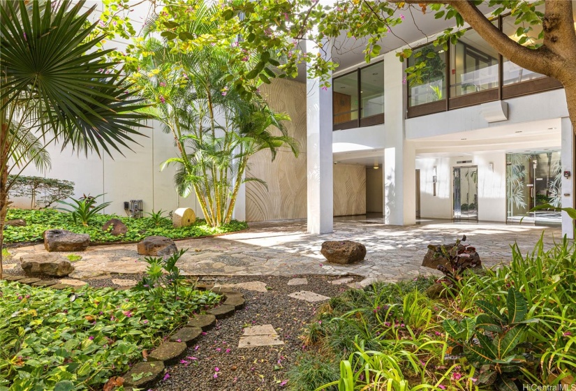 Building entry on Queen Street has a nice garden area. Lobby can be seen on the right.