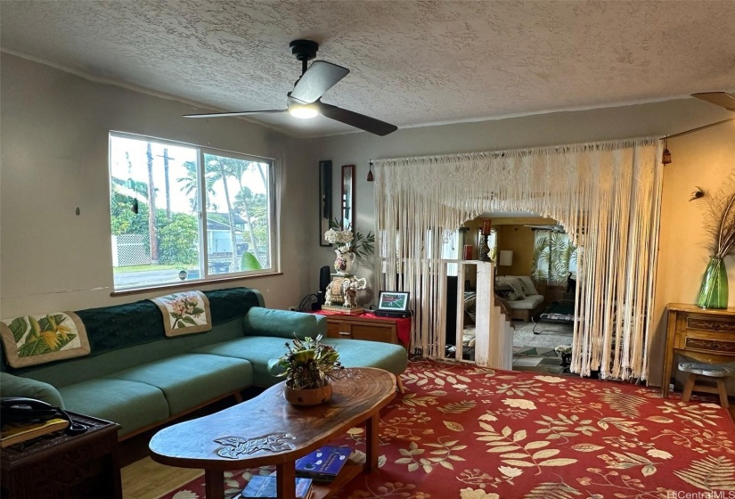 Living area with stairs down to family room