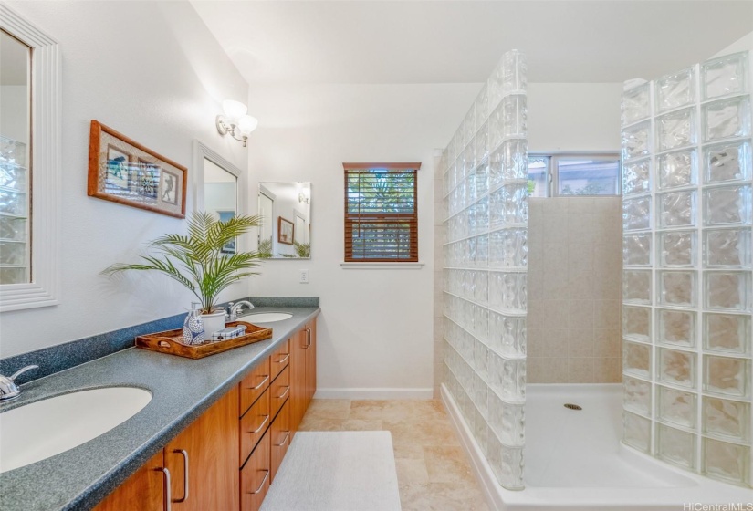 1st Floor Primary bathroom with double vanities and walk in glass block shower