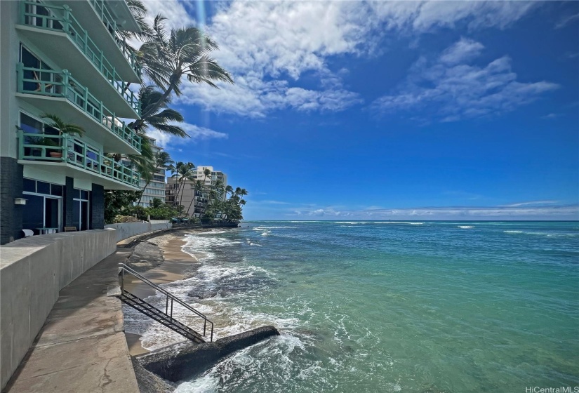 There are stairs down to the water from the seawall.