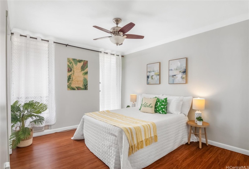 Bedroom #1 with ceiling fan and windows.